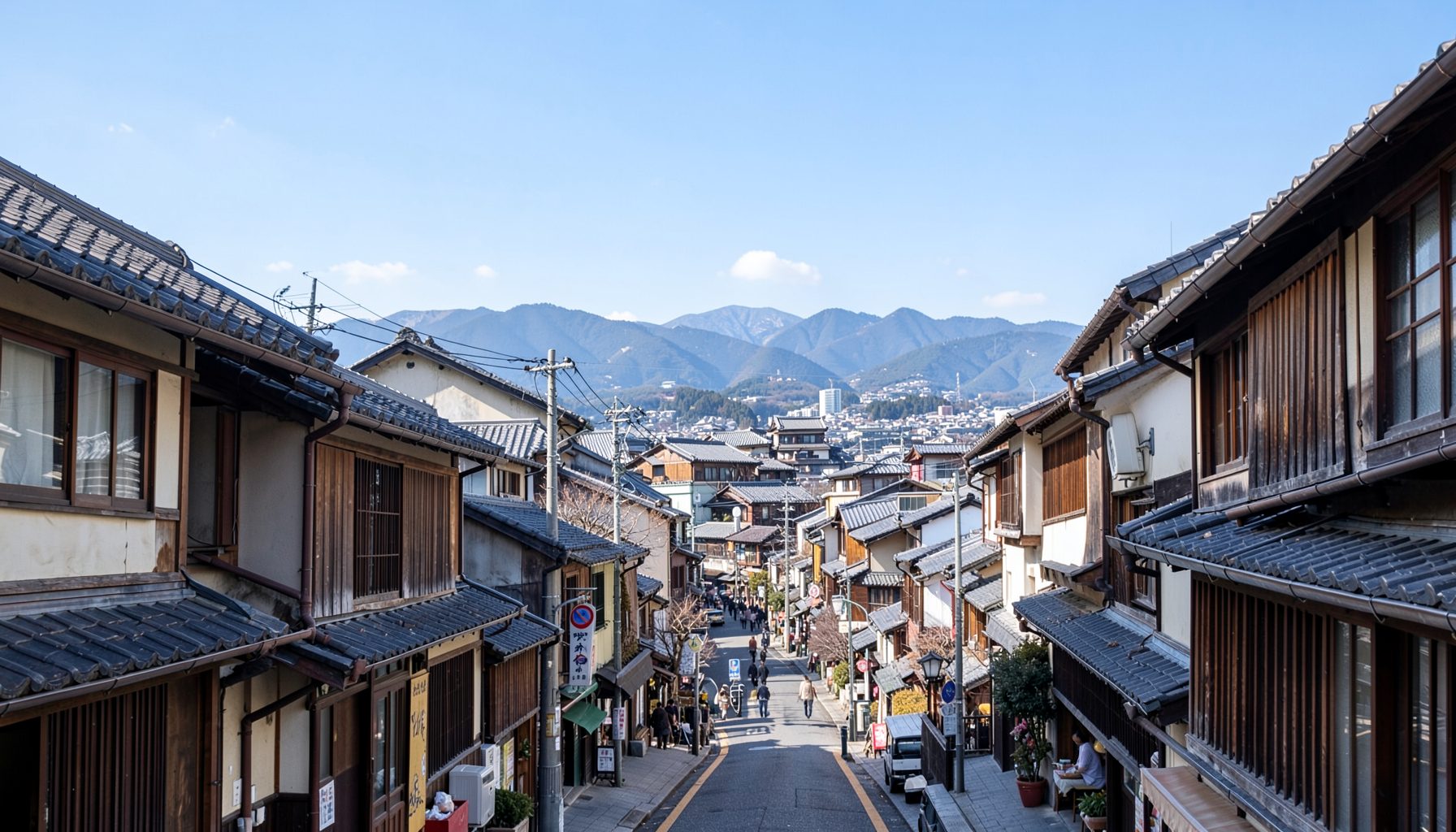 金沢の伝統的な町並みと青空が広がる穏やかな昼下がりの風景
